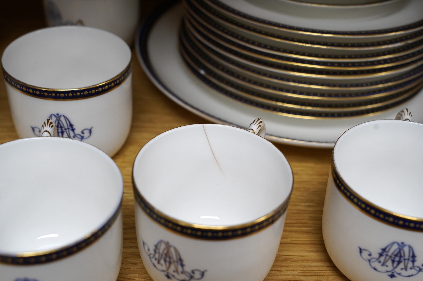 A Royal Worcester blue and gilt crested part tea set together with a set of seven floral Rosenthal miniature porcelain dishes, largest 22cm in diameter. Condition - varies, mostly fair